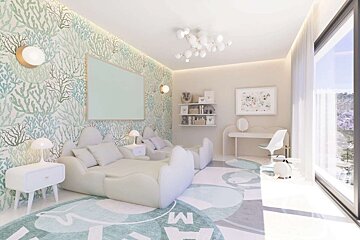 A vibrant, modern kids' bedroom features sea-themed coral wallpaper, two white beds, a whale rug, a study desk, and a large window.
