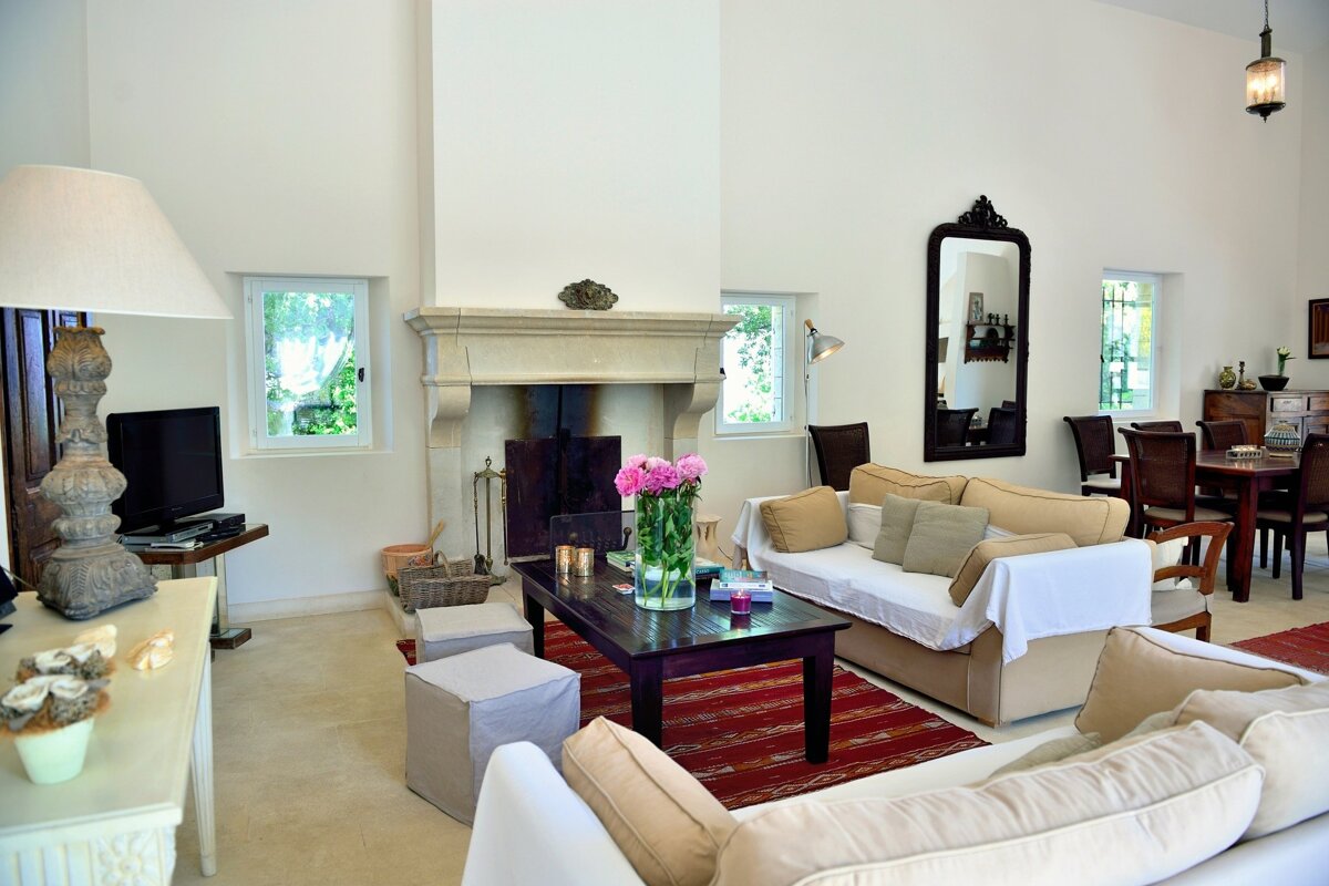 A living room with a fireplace and a couch