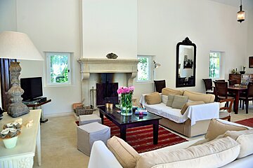 A living room with a fireplace and a couch