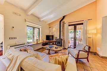 A living room with a couch a chair and a television