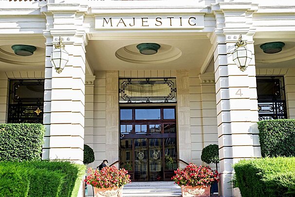 A white building with a sign that says majestic