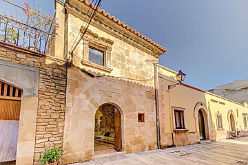 A building with a plaque on it that says ' a ' on it