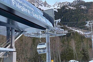 A ski lift with the word telecabine on it