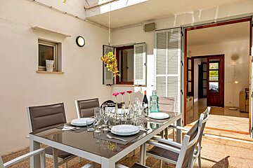 A table with plates and wine glasses on it