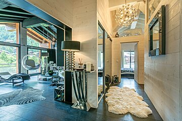A kitchen and dining area with a zebra print rug