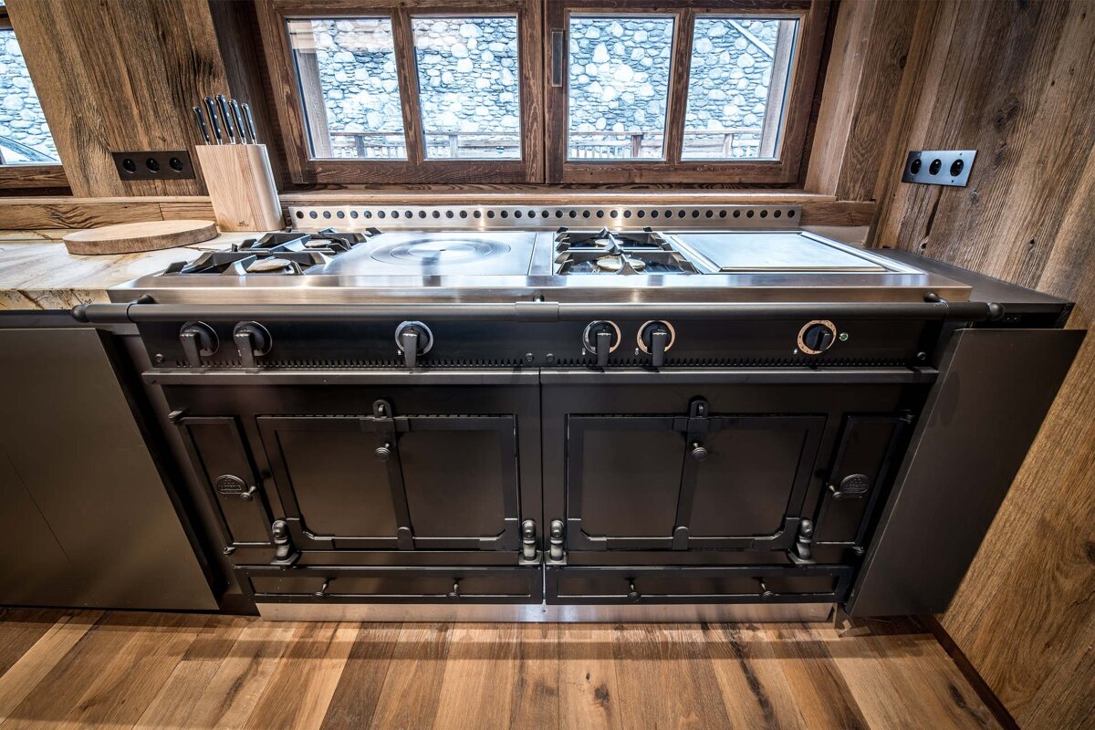 A kitchen with a stove that has the number 0 on it