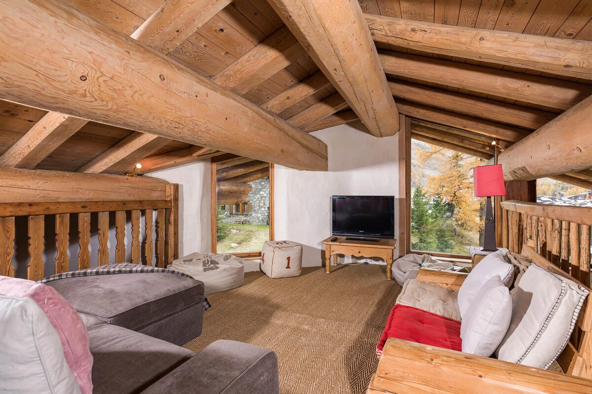A living room with a couch and a flat screen tv