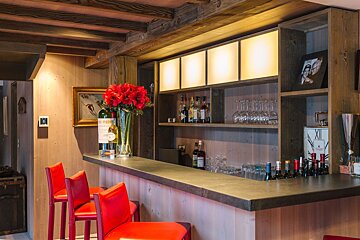 A bar with a sign that says xii on it