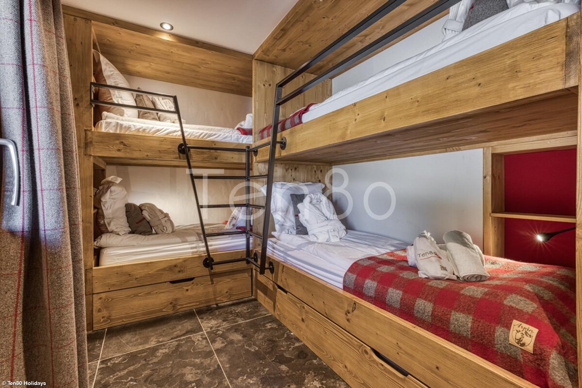 A room with bunk beds and a sign that says turbo holidays