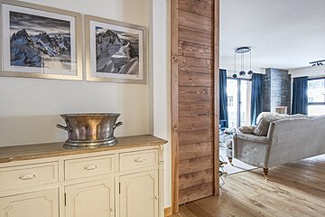 A living room with a couch and a dresser