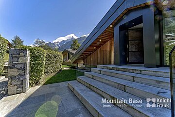 Stairs leading up to a mountain base immobilier real estate building