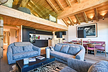 A living room with a couch a chair and a coffee table