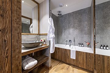 A bathroom with a bathtub and a sink