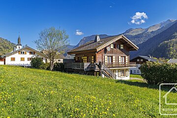 A picture of a house in the mountains taken by alpine photo