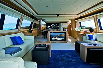 A living room with a couch and a television with a boat on it