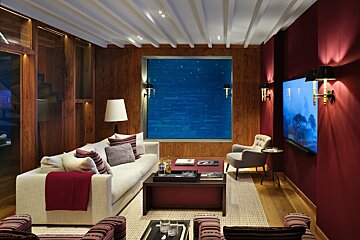 A living room with a couch and a television
