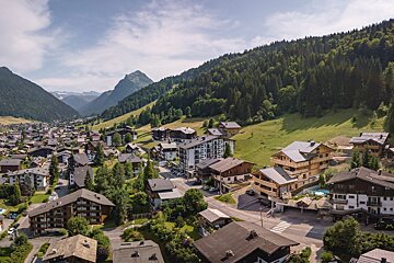 An aerial view of a small town in the mountains