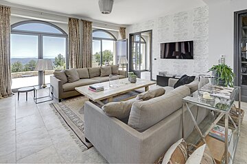 A living room with a couch and a flat screen tv