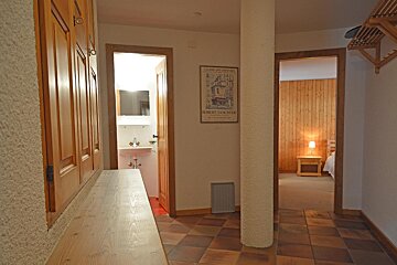 A hallway with a poster on the wall that says robert van riet