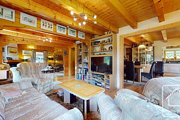 A living room filled with furniture and a flat screen tv