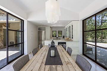 A dining room table with a candle on it