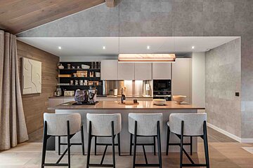 A living room with a wooden table and chairs