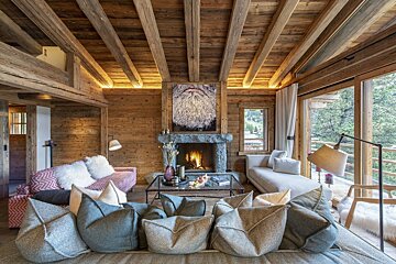 A living room filled with furniture and a fireplace
