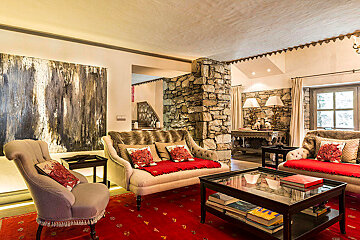 A living room with a couch a chair and a coffee table
