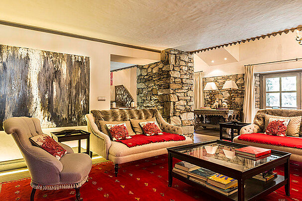 A living room with a couch a chair and a coffee table