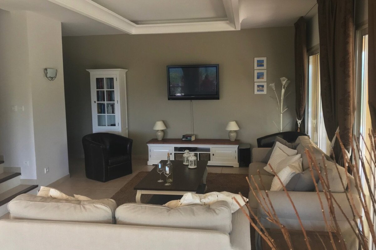 A living room filled with furniture and a flat screen tv