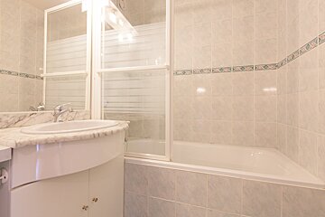 A bathroom with a sink and a bathtub