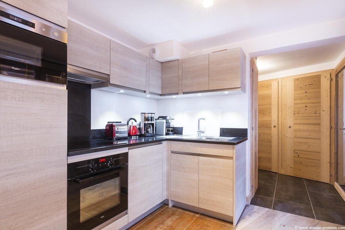 A kitchen with a bosch oven and a toaster oven