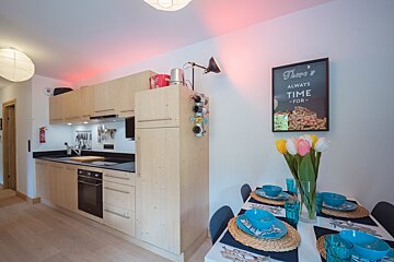 A kitchen with a sign that says there 's always time for
