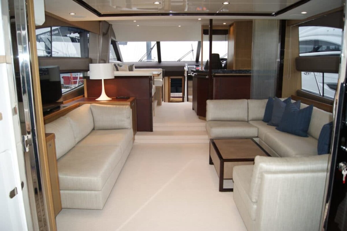 A living room on a boat with a couch and a table