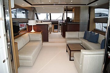 A living room on a boat with a couch and a table