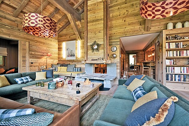 A living room with lots of furniture and a fireplace