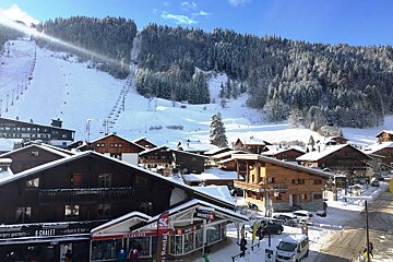 A ski resort with a rental store in the foreground