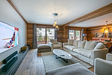 A living room with a couch and a flat screen tv