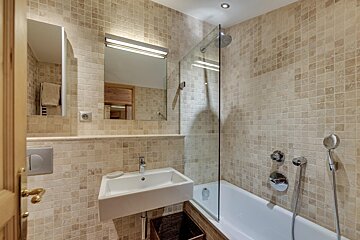 A bathroom with a sink and a bathtub