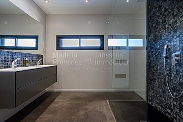 A bathroom with the words made in provence by immobilier on the wall