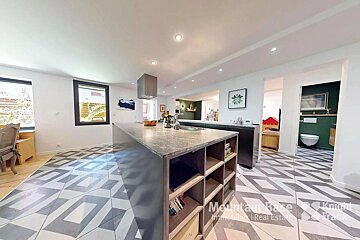 A kitchen with a tiled floor and a sign that says mountain race