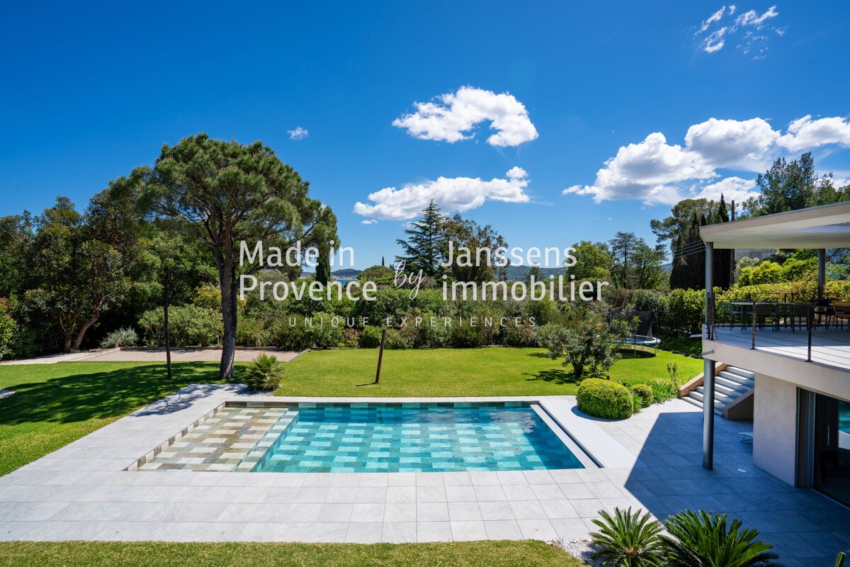 A large swimming pool with the words made in provence by immobilier