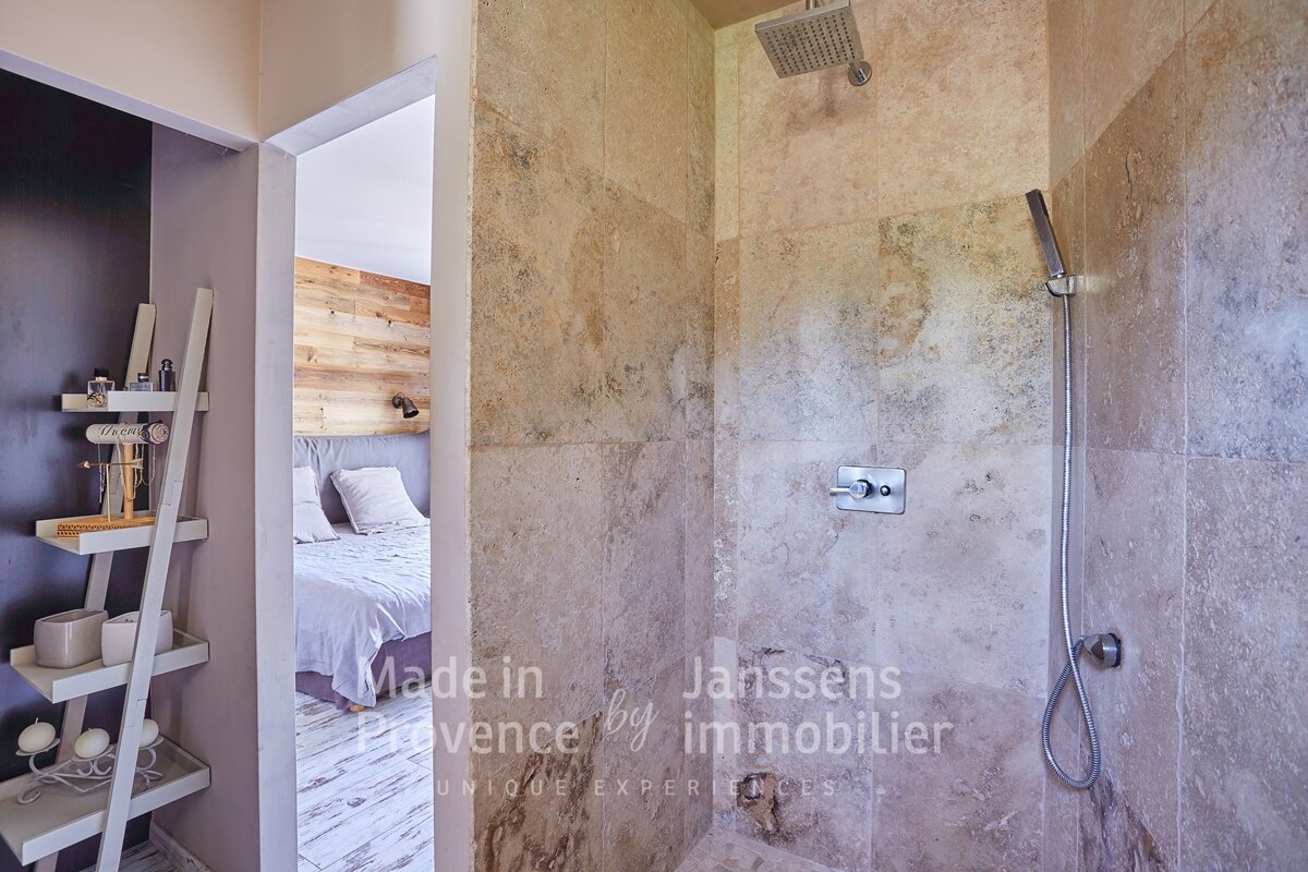 A bathroom with the words made in provence by immobilier on the wall