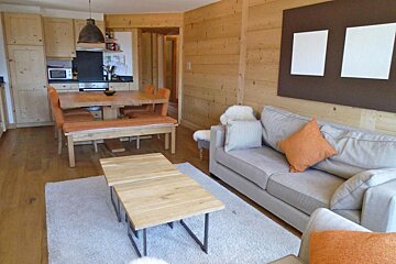 A living room with a couch and a table