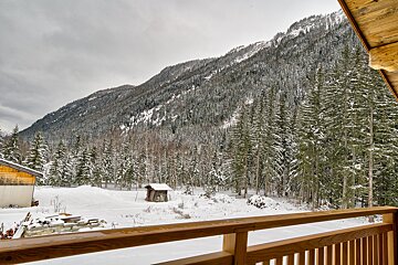 A view of a snowy mountain from a balcony