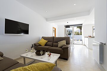 A living room with a couch and a flat screen tv