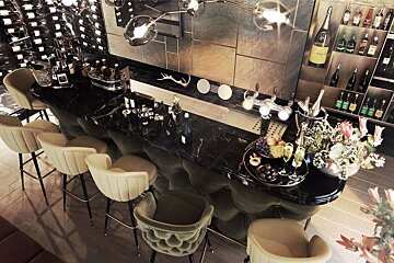 A bar with a bottle of chandon on it