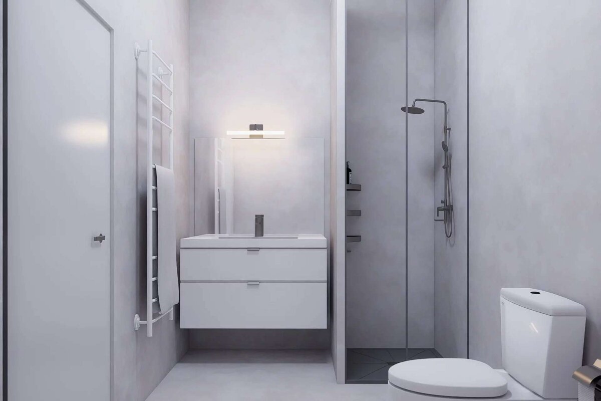 A sleek, minimalist white and light gray bathroom featuring a floating vanity, mirror, shower stall, toilet, and towel warmer.