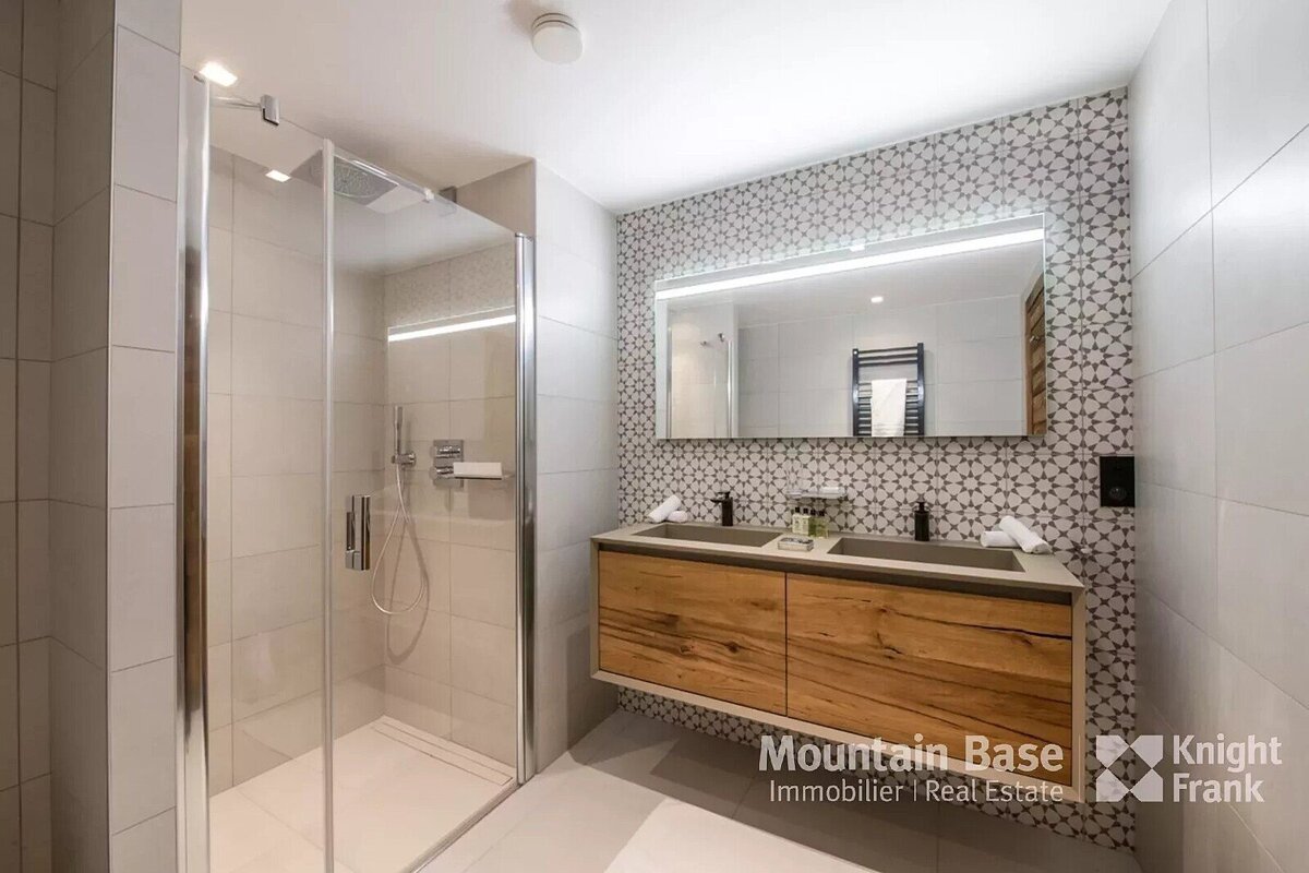 A bathroom with a knight frank logo on the bottom