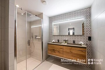 A bathroom with a knight frank logo on the bottom